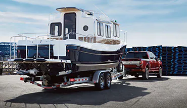 2022 Nissan TITAN Truck towing boat | Coral Springs Nissan in Coral Springs FL