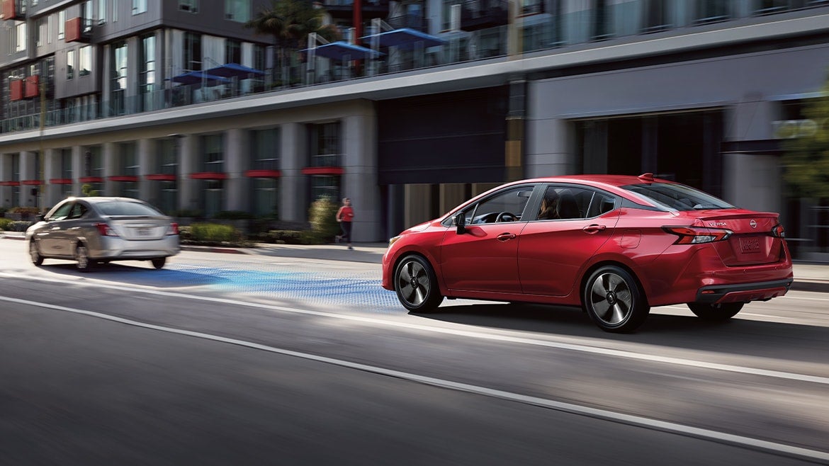 2023 Nissan Versa showing safety shield 360 sensors while driving downtown.